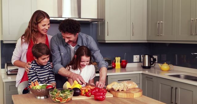 A joyful family is gathered in their modern kitchen, preparing a healthy meal together. Parents and children are engaged in cutting vegetables and setting up a fresh, colorful salad. This can be used for illustrating family bonding activities, promoting healthy eating habits, and depicting happy, modern family life.