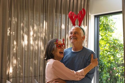 Elderly Couple Celebrating Holiday with Joyful Affection