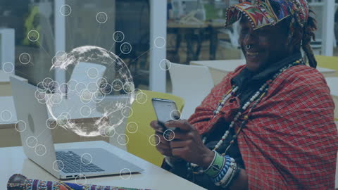 Man in Ethnic Wear Exploring Global Connections via Smartphone