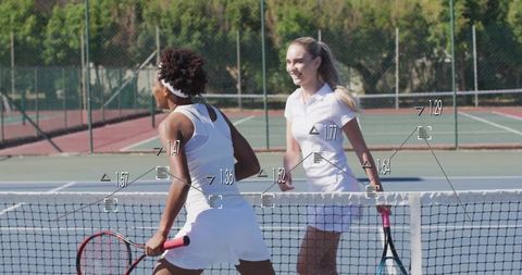 Tennis Players Shaking Hands at Court Net in Sunny Outdoor Setting