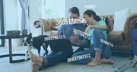 Couple analyzing finance with technology at home