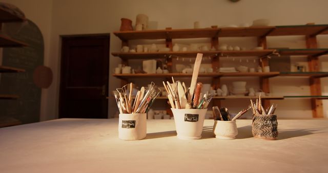 Art Studio with Various Painting Tools on Shelf and Table - Download Free Stock Images Pikwizard.com