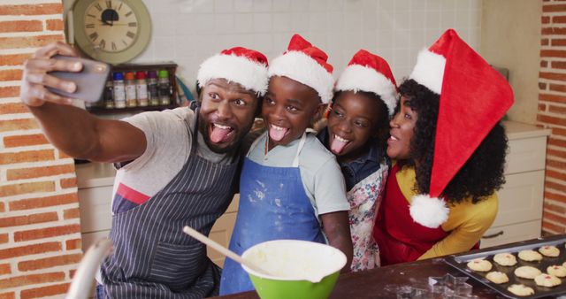 Family enjoying holiday baking activity, posing for selfie. Great for holiday advertisements, family-oriented promotions, or festive greeting cards.