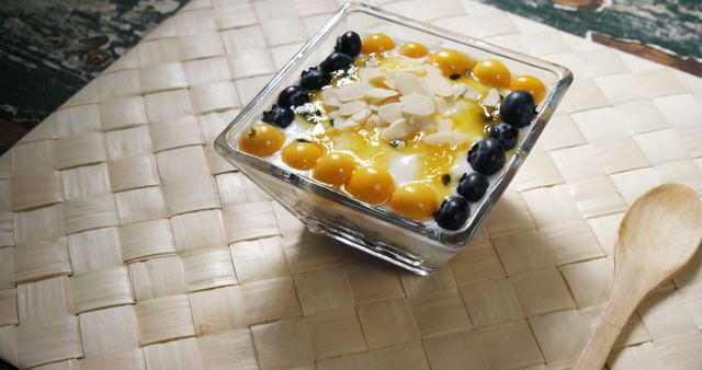 Healthy Yogurt with Fresh Berries and Almonds in Glass Bowl on Woven Mat - Download Free Stock Images Pikwizard.com