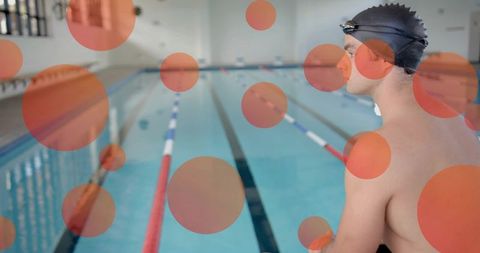 Focused Swimmer Preparing to Dive at Indoor Lap Pool