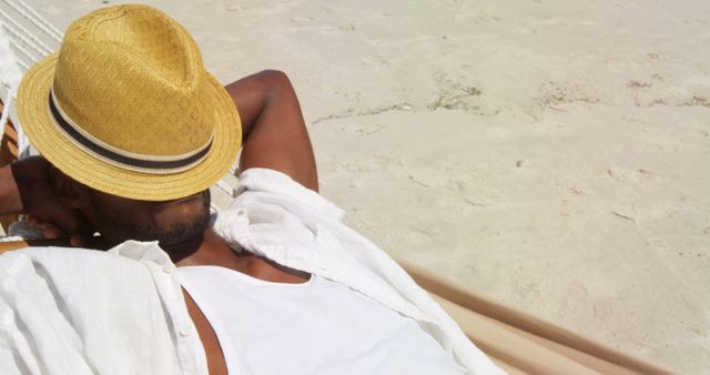 Man Relaxing on Beach in Straw Hat - Download Free Stock Images Pikwizard.com