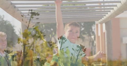 Boy Swinging on Monkey Bars at Playground