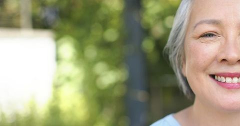 Caucasian Senior Woman Smiling Amidst Lush Greenery Outdoors - Download Free Stock Images Pikwizard.com