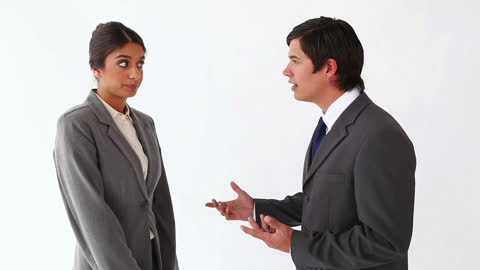 Business Discussion Between Man and Woman in Professional Attire