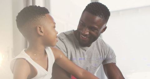 Loving African American Father Bonding with Young Son