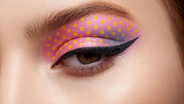 Vibrant pink purple gradient eye makeup featuring yellow polka dots and black winged liner