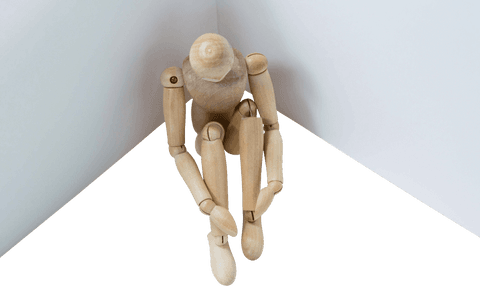 transparent wooden figurine sitting in reflective pose - Download Free Stock Videos Pikwizard.com