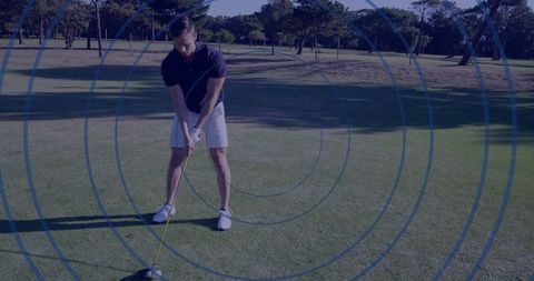 Golfer Preparing Swing on Lush Fairway