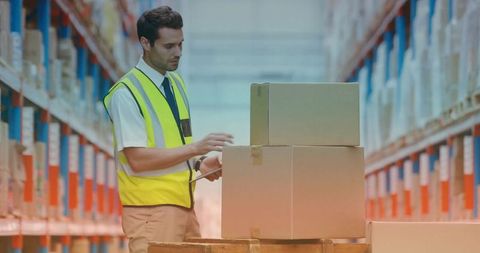 Warehouse Worker Scanning Boxes with Handheld Scanner Wearing High-Visibility Vest and Tie