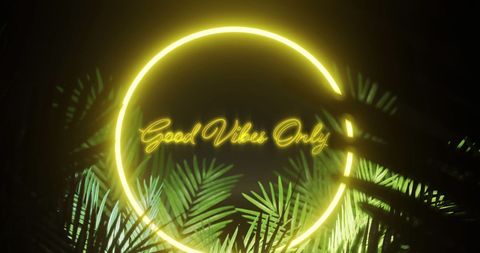 Glowing neon sign with inspirational message and tropical leaves