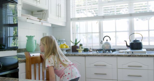 Curious Child Watching Oven in Bright Modern Kitchen - Download Free Stock Images Pikwizard.com