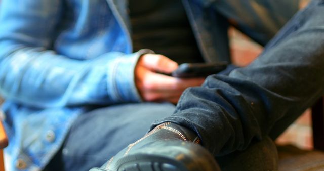 Casual Man Relaxing Indoors Using Smartphone - Download Free Stock Images Pikwizard.com