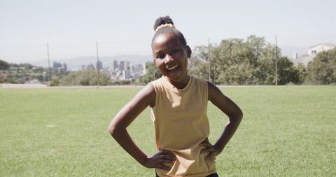 Joyful African American Girl on School Field on Sunny Day