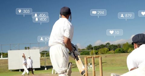 Male Cricket Players Engaged in High-Tech Social Media Interaction