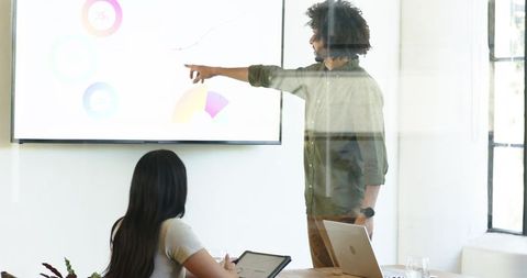 Business Presentation in Modern Office with Diverse Team Collaboration
