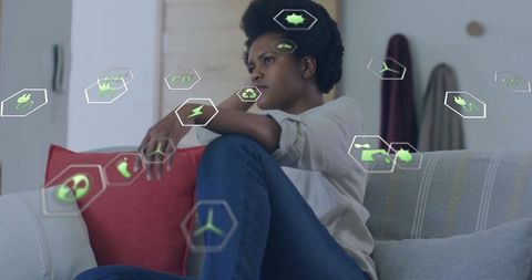 Thoughtful Woman with Floating Sustainable Technology Icons