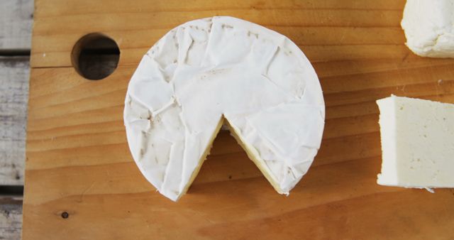 Rustic Brie Cheese with One Cut Slice on Wooden Board - Download Free Stock Images Pikwizard.com