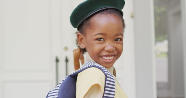 Image of happy african american girl in scout costume delivering packages. scouting, hobby and childhood concept.