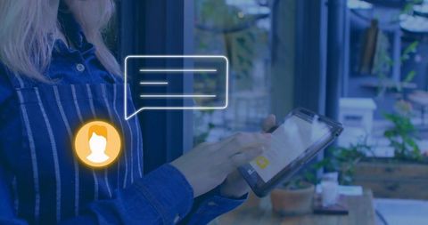 Barista tapping tablet pos for digital orders in modern cafe with minimalist workflow