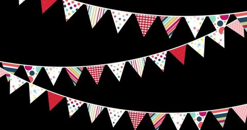Colorful party bunting with geometric patterns hanging