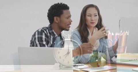 Diverse Colleagues Discussing Project with Time Management Theme