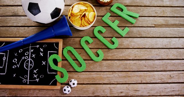 Soccer Equipment and Snacks on Wooden Surface - Download Free Stock Images Pikwizard.com