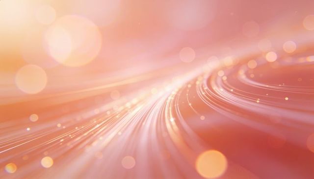 Luminous pink-orange light trails curving into bokeh glow for futuristic backgrounds