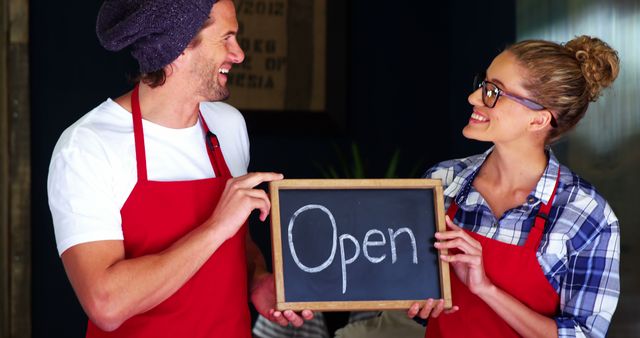 Smiling Coffee Shop Owners Holding Open Sign - Download Free Stock Images Pikwizard.com