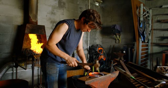 Blacksmith Working in Forge with Hammer and Anvil - Download Free Stock Images Pikwizard.com