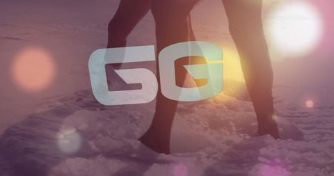 Silhouette Couple Stand in Surf at Sunset with 5G Connection Overlay