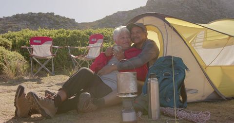 Senior Couple Relaxing on Outdoor Camping Adventure