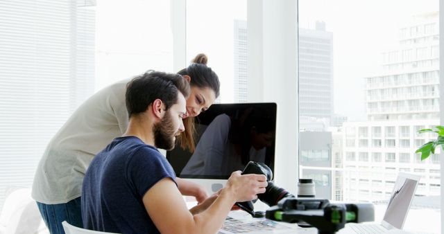 A young Caucasian couple is engaged in a creative project at a home office, with copy space - Download Free Stock Photos Pikwizard.com