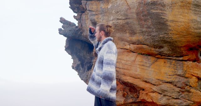 Woman in Warm Coat Looking Off Cliffside - Download Free Stock Images Pikwizard.com