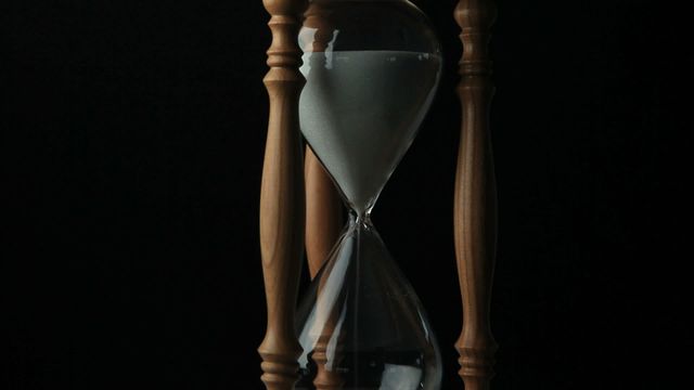 This video displays a classic hourglass made of wood with flowing sand set against a black background. The hourglass symbolizes the passage of time and can be used to highlight themes such as time management, countdown, or the historical aspects of timekeeping. Ideal for articles, presentations, or advertisements related to productivity, deadlines, antiques, or vintage decor.