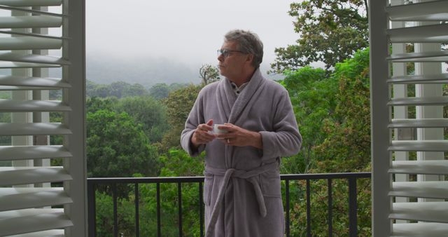 Senior Man in Bathrobe Enjoying Morning Coffee on Balcony - Download Free Stock Images Pikwizard.com