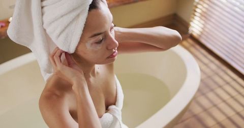 Woman with Vitiligo Enjoying Relaxation Time in Bath