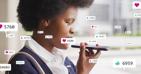 Black businesswoman speaking into smartphone at transit stop with social media overlays