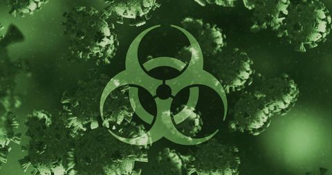 Biohazard Symbol Over Coronavirus Covid-19 Cells Concept