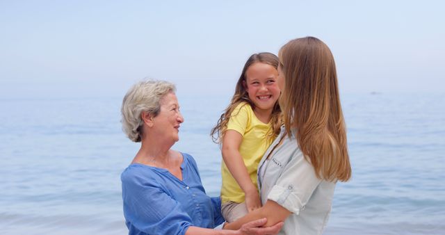 Three Generations Enjoying Time Together at Beach - Download Free Stock Images Pikwizard.com