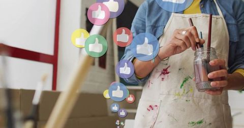 Artist Painting with Social Media Engagement Icons