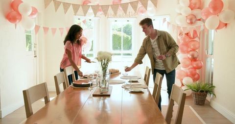 Diverse Friends Decorating for Festive Home Celebration
