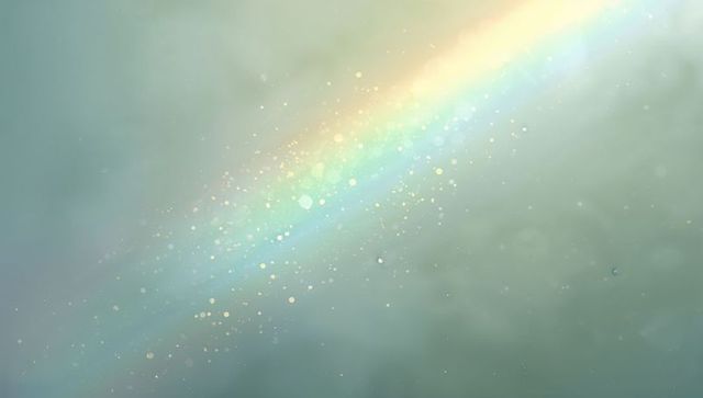 Pastel rainbow light beam cutting through mist with golden bokeh glow
