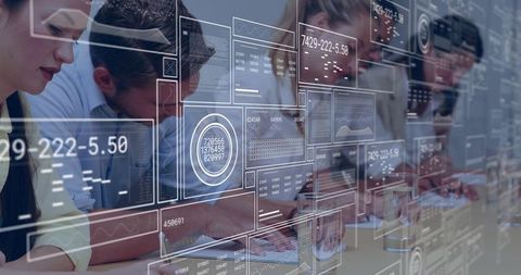 Business Team Collaborating on Digital Dashboards with Futuristic Holographic Interfaces