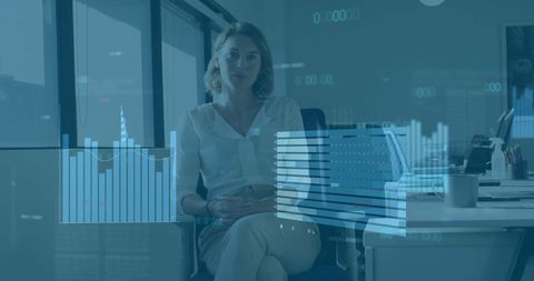 Businesswoman in Office with Financial Data Projections - Download Free Stock Images Pikwizard.com