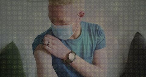 Man Wearing Face Mask with Wristwatch Relaxing at Home